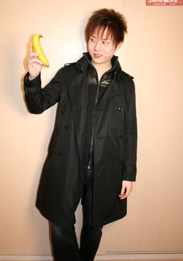 Cute Korean boy playing with his banana